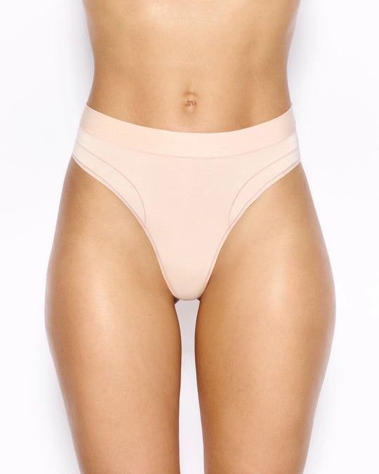 Model wearing nude Smoother Thong – High Waist (Limited), seamless and second-skin soft for all-day comfort.